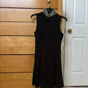 Elegant Black Sleeveless Dress with Pearl Detail
